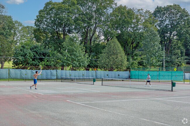 Getting in an early tennis match at Leewood Park.