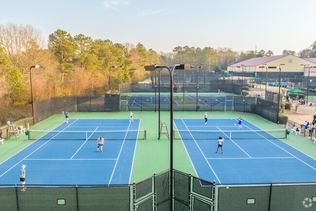Residents head to Peachtree City Tennis Center in the evenings to practice and play.