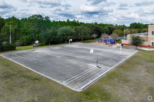 Children enjoy playing basketball on the spacious court at Columbia Elementary School.