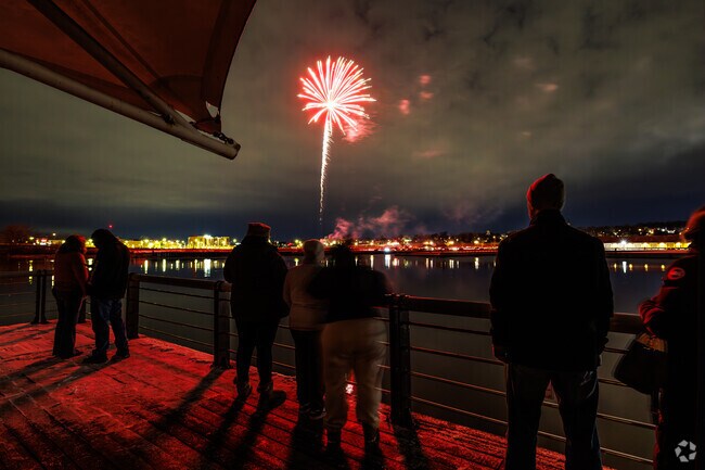 Residents of Lyncourt view fireworks during Winterfest 2024 at the Inner Harbor of Syracuse.