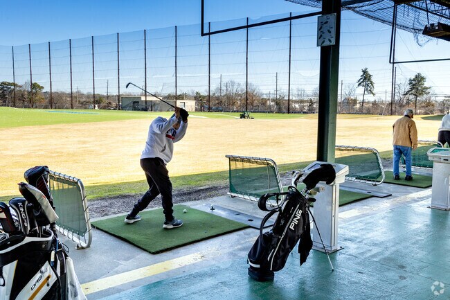 Practice your drive at Heartland Golf in nearby Deer Park.