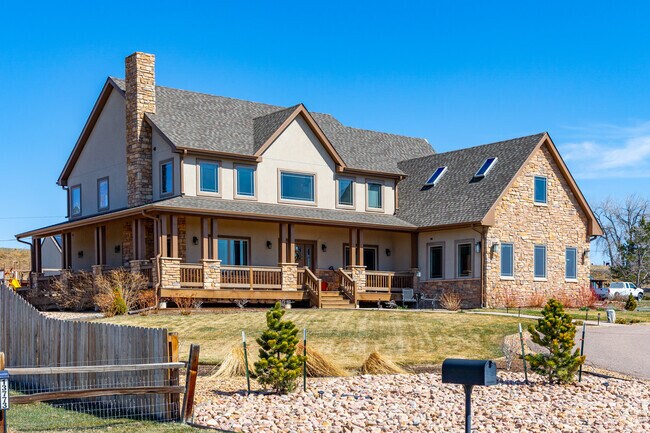 Some modern traditional homes with natural stone facades can be found in Cameo Estates.