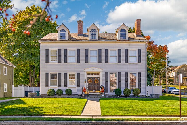 Colonial influenced homes with green lawns can be found in Newton, NJ.