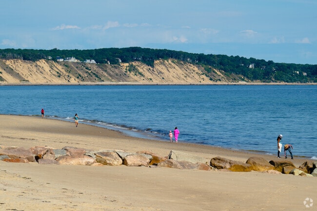 Locals often walk the shoreline at Sagamore Beach.