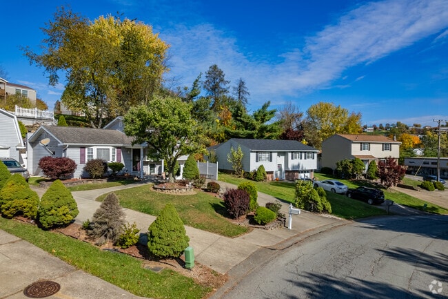Follow the rows of homes in North Huntingdon on the manicured lots.