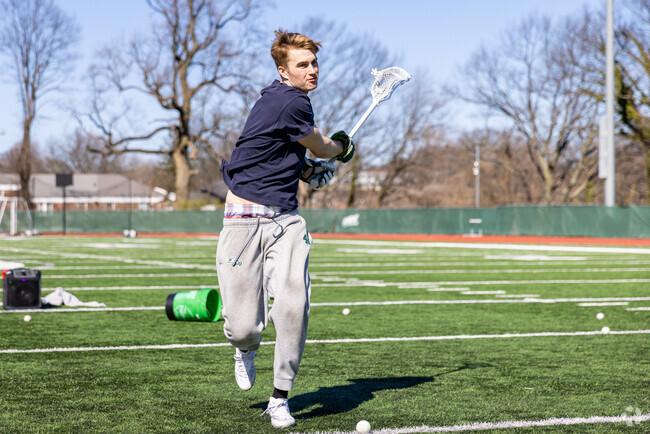 Lacrosse players from Grymes Hill's Wagner College practice at Wagner's stadium.