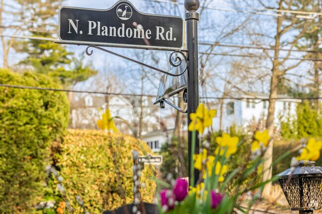 Ornate signs line the streets of Plandome Manor.