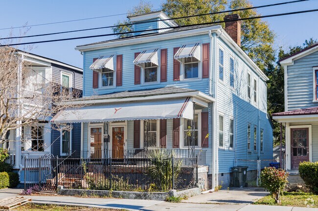 Hampton Park Terrace in Charleston has beautiful four-square style homes with iron fences.