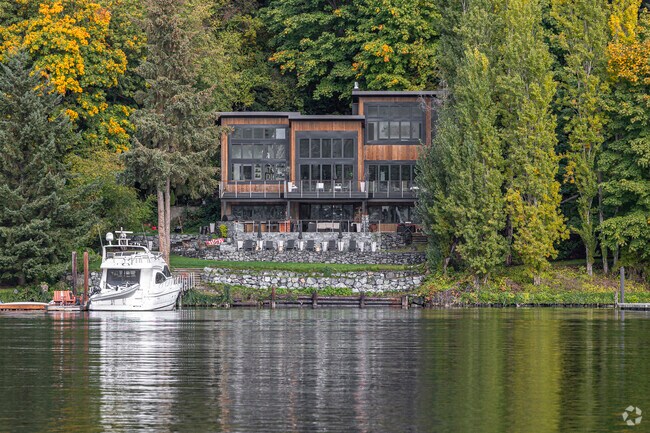 A contemporary home sits along the water near Skansie Brothers Park.