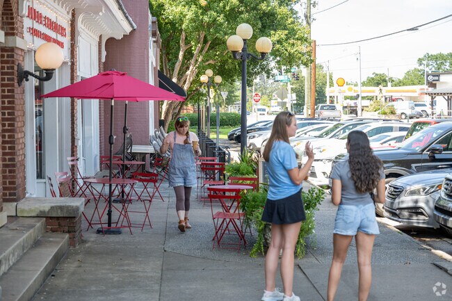 Locals enjoy the very walkable streets of downtown Five Points.
