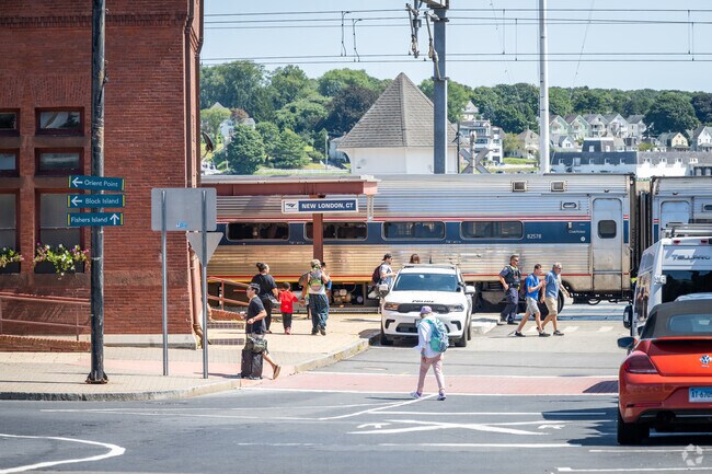 Experience the vibrant activity of train travelers at Union Station, Downtown New London.