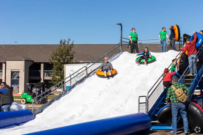 Go sledding on the snow slide at the annual YMCA Christmas Dreams & Snowy Things.