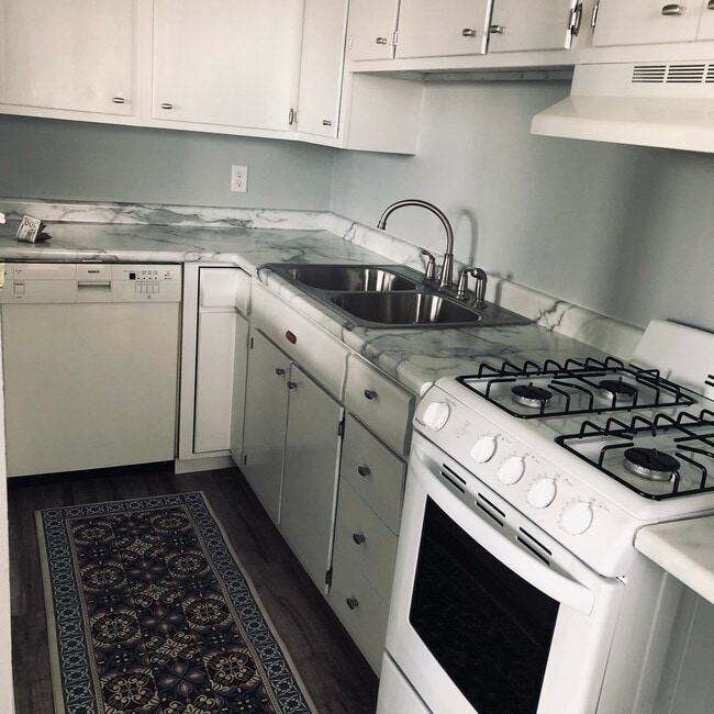 New dishwasher gas range and refrigerator