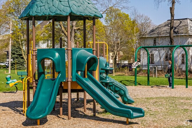 A structure for younger kids and wide row of swings awaits kids vising Memorial Park Playground.
