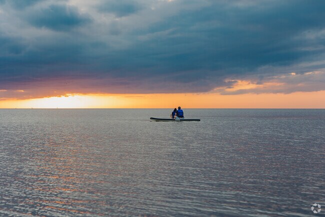 Avon families love to paddle out on the Pamlico Sound to watch a stunning sunset.