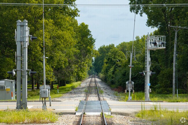The railroad runs adjacent to the neighborhood's east side, a buffer of trees help noise.