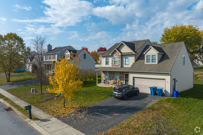 Traditional homes in Manchester have large yards and two-car garages.