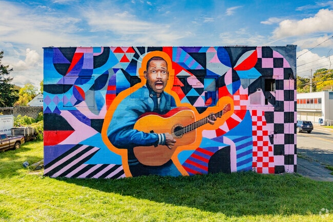 Eli Harris, the “Godfather of Syracuse music,” lives on through Elmwood’s mural—a symbol of joy, strength, and local pride.