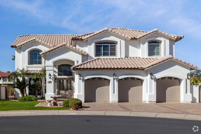 This beautiful Spanish style home is one of many lakeside homes in The Islands.