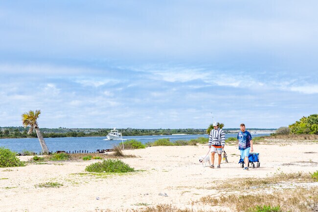 Locals walk with their pets on Rattlesnake Island in Butler and Crescent Beaches.