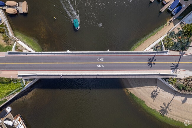 Quaint bridges connect the island, offering stunning vistas of Newport Harbor.