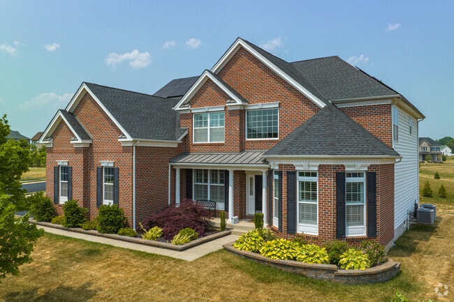 Well manicured brick Colonial home on Caitlin Way in St. Georges.