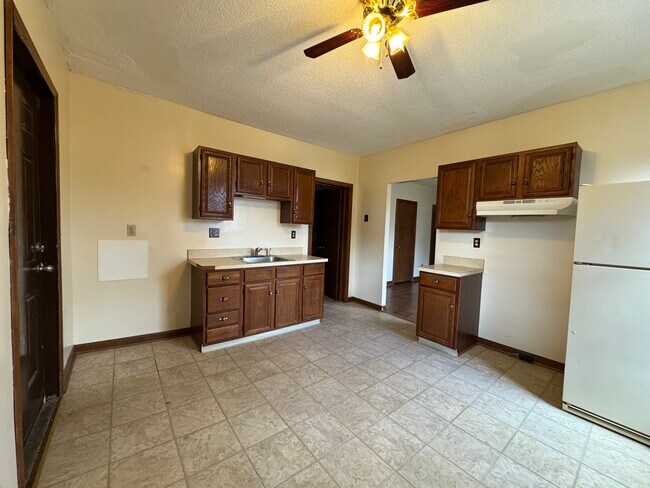 Kitchen w/ new glass top stove and new stainless fridge