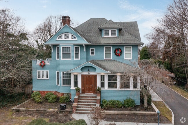 A colonial-style home is blue tinted and is seen in Babylon, New York.