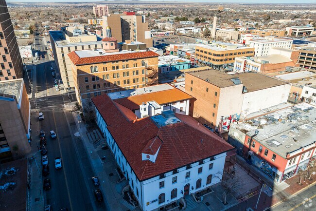 A wide view of Amy Biehl Charter High School and surrounding buildings.