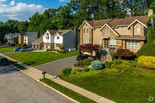 Large colonial homes are common in Pines Lake.