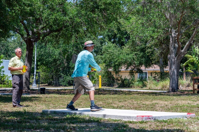 Friends gather at North Water Tower Park in Bayou Oaks to challenge each other at disc golf.