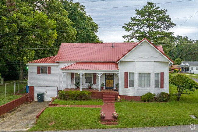 The red roof on this house gives it a unique look in South Pratt.