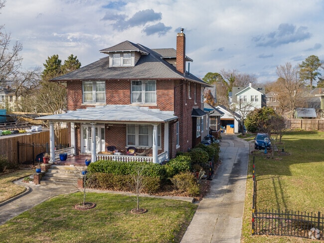 Older brick homes with long driveways and separate garages are common in Park Place.
