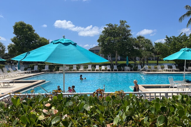 Families often gather outdoors in Jonathan's Landing for sunny afternoons.