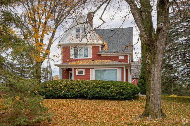 This two-story farmhouse in Independence, MN offers cozy living.