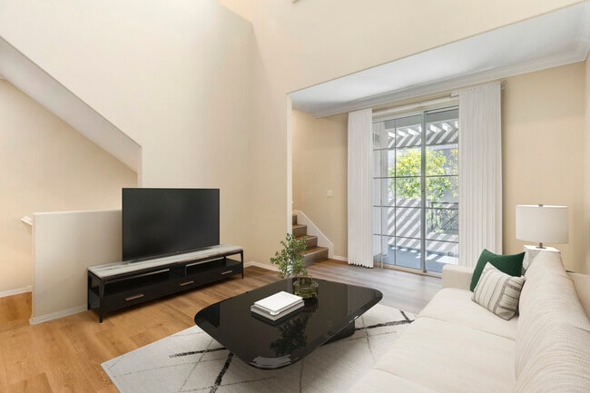 Renovated Package I living room with hard surface flooring