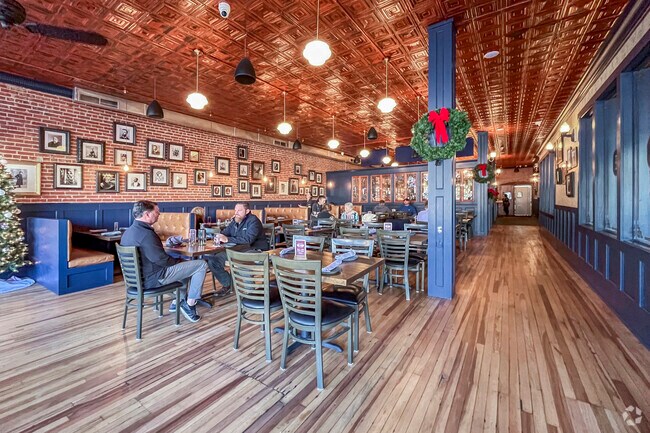 The interior decor of The Farehouse displays local and world history in photos lining the walls.