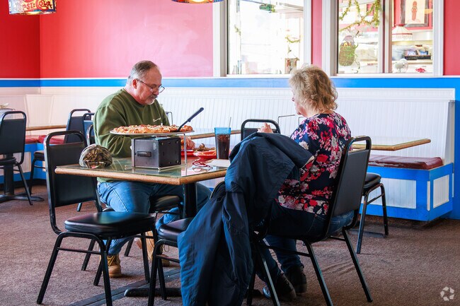 Patrons enjoy some pizza at Pepi's Pizza in Oneida.