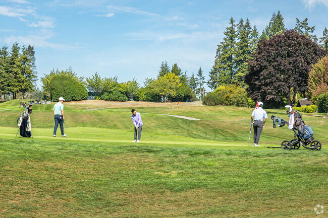 Hit the links with a couple buddies near Yeomalt Point at Wing Point Golf & Country Club.