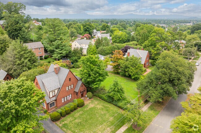 Tudor cottages overlook the city nestled within trees and pretty landscaping in South Roanoke.
