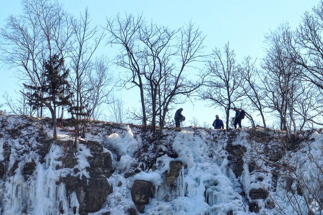 Ice climbers try their skills along the rock walls in Winona Ice Park.
