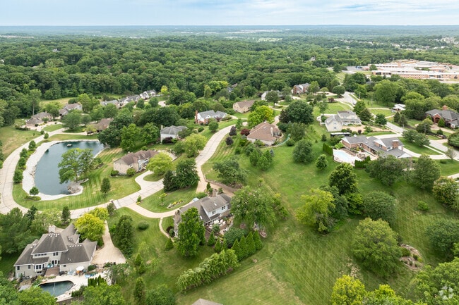 This Sunset Hills neighborhood features a large retention pond.