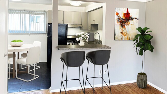 WIndowed nook, bistro dining bar, cool grey cabinets, stainless or jet black appliances.