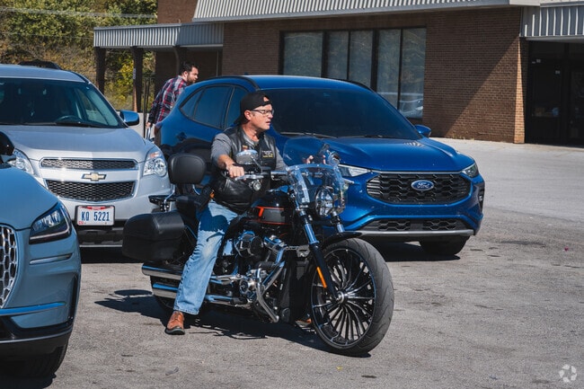 This motorcyclist plans his route before leaving Shawnee Plaza after a delicious lunch.