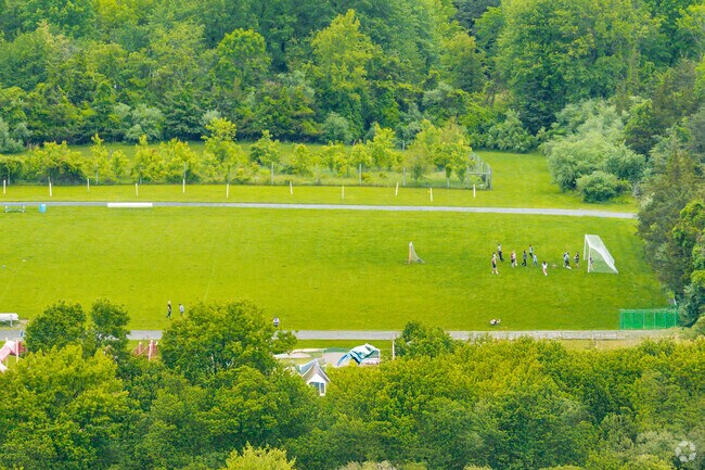 On weekdays, this field pulses with life and energy, a sign of a town that values movement, friendship, and a well-rounded education.