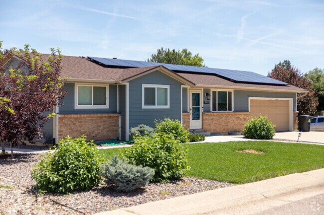 Some Acres Green ranch style homes feature beautiful landscaping.