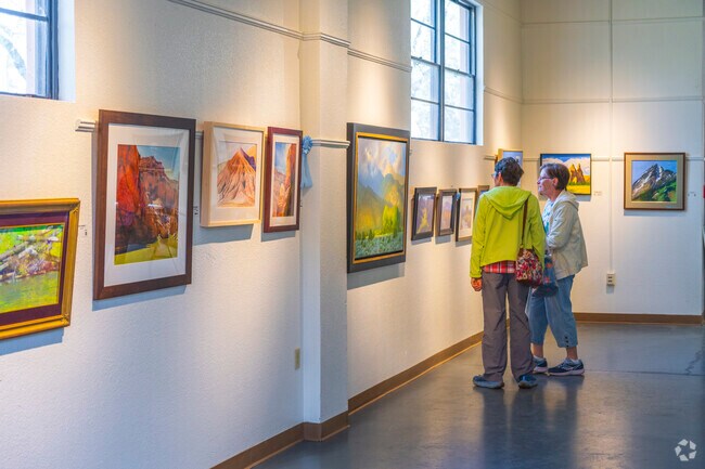 Art lovers enjoy the paintings at the MasterWorks of New Mexico Fine Art Show, located a few miles from Mirabella.