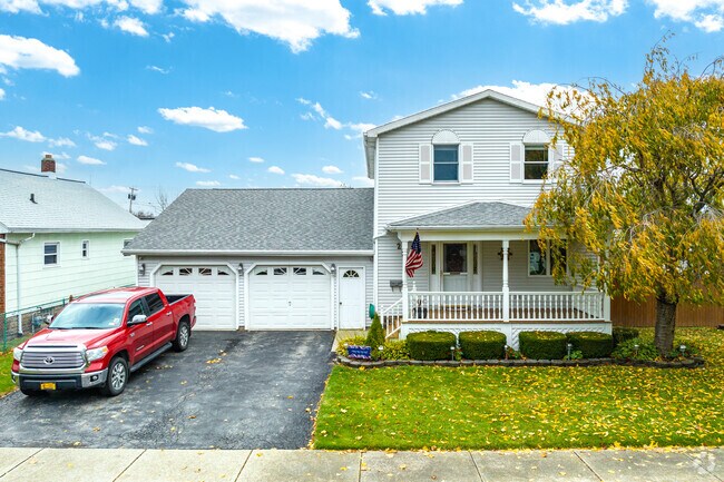 Hyde Park homes often feature wide driveways, attached garages, and spacious yards.