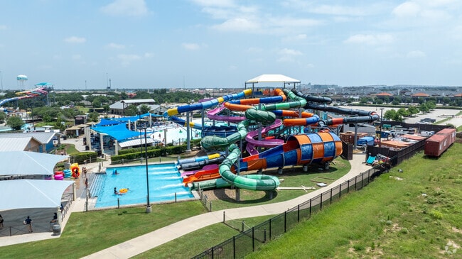 Families enjoy a splash-filled day at Typhoon Texas water park.