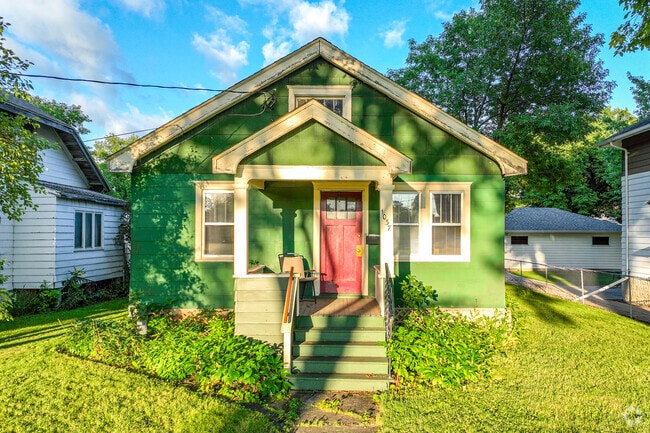 This cozy green home is among many similar homes in Horace Mann.